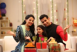 family celebrating diwali at home with full of happiness