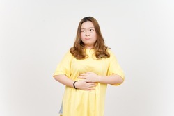 Stomachache gesture think about food, hungry concept of Beautiful Asian Woman wearing yellow T-Shirt Isolated On White Background