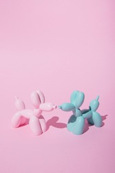 Balloon dogs in love on pastel pink background. Love card. Layout. Flat design. Minimal valentines mood concept.