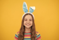 happy easter child girl in rabbit bunny ears smiling on holiday, easter