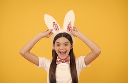 look at that. funny child in rabbit ears. smiling teenager girl in bow tie. bunny hunt begin