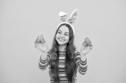 happy easter kid girl in rabbit bunny ears hold colorful eggs for holiday, easter bunny