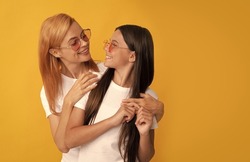 happy family portrait of single woman mother embrace kid in glasses, friends