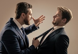 two angry businessmen fighting and arguing having struggle for leadership, rivalry.