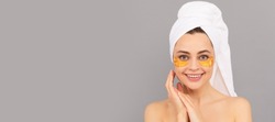Eye patches, patch under eyes. happy woman with terry towel use facial golden eye patch for skin, skincare. Beautiful woman isolated face portrait, banner with mock up copy space.