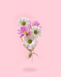 A bouquet of fresh Spring pink and white flowers. Creative pastel colored concept.