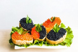Sandwiches with red and black caviar    