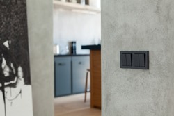 Switch and socket in the kitchen background