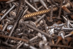 Background of iron nails screws construction steel metal texture macro close up hardware different old rusted  Top View.