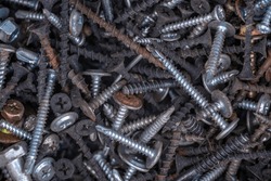 Background of iron nails screws construction steel metal texture macro close up hardware different old rusted  Top View.