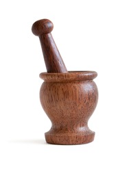 wooden mortar with pestle on a white background