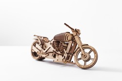 Designer of wood in the shape of a motorcycle on a white background