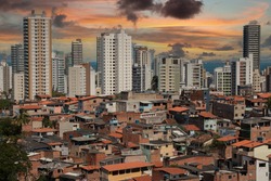 Urban social contrast. Buildings and slum. Inequality