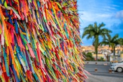 Brazilian ribbon (Lembranca do Senhor do Bonfim) from Salvador, Bahia used to tie around wrist three times and make 3 wishes. Translation: Reminder of our Lord of Bonfim