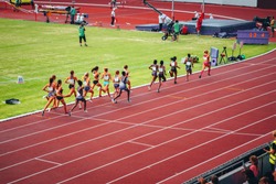 Female track and field race at athletics stadium. Professional female runners. Concept photo for olympic competition in tokyo 2020