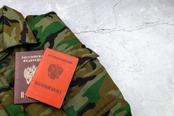 Passport, military ID on a military uniform and a citizen of the Russian Federation. Text in Russian PASSPORT OF THE RUSSIAN FEDERATION and MILITARY ID