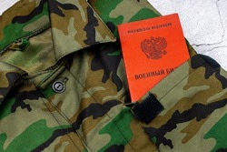 Military uniform and military ID of a citizen of the Russian Federation. Translation: 
