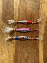 Set of Fishing lure in a wooden table . These baits is used for jigging and casting in ocean, sea , river , or a lake.