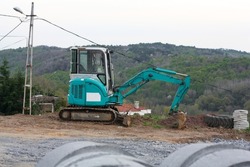 Construction machinery tractor with bucket and excavator
