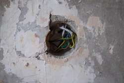 Old electric wire in wall. Renovation of flat wiring.