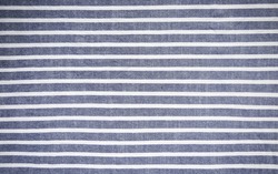 Dark blue and white stripes fabric background.