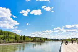 Beautiful weather with blue sky and white clouds of the Yukon River in downtown Whitehorse, Yukon Territory, Canada