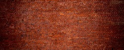 Large Old Red Brick Wall Background. Wide Angle Vintage Brick Texture. Panoramic Web banner or Wallpaper With Copy Space.
