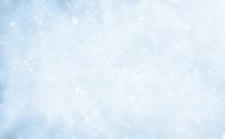 Beautiful Nature Winter background. Falling snow flakes on blurred blue and white background. Soft Christmas background With Copy Space for design