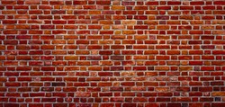 Panoramic Old Red Brick Wall Background. Beautiful Vintage Brickwall Texture. Wide Angle Grunge Web banner or Wallpaper With Copy Space.