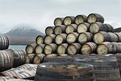 Bunnahabhain distillery, Islay, Scotland. Whisky casks stockpiled outside Bunnahabhain distillery Islay, waiting to be filled. Feb 2017