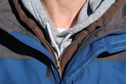 A man wearing many layers of clothing. Layering jackets in the winter.