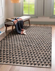 Black and grey interior room living area rug carpet.