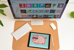 NFT on a digital tablet on a desk illustration of a pig