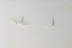 Water seeps on the walls and ceiling after heavy rain or water leaks causing cracks.
