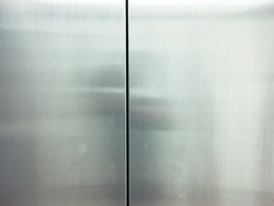 The elevator door made from stainless steel with color tone for background or texture.