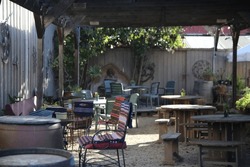 Rustic Outdoor Seating Area Under an Awning in the Sun