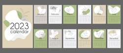 Abstract calendar for 2023 in vertical A4 format.12 months and cover. Calendar in neutral natural colors with abstract spots and linear floral elements. With place for notes. Week strats on Sunday.