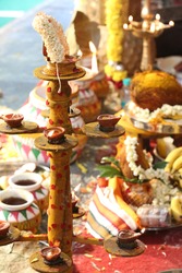South Indian wedding rituals, Hindu wedding rituals, decorated wooden stand for lamps or diyas in Hindu Tamil wedding