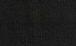 Black canvas abstract texture background. Completely black. Close-up of black fabric. Black abstraction