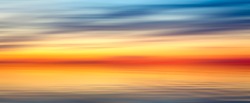 Nice bright red yellow blue abstract blur texture background web banner panorama landscape with sunset on lake