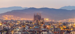 Aerial Panorama view of Barcelona city skyline and Sagrada familia at dusk time,Spain