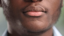 Close-up of the male lips of a black man