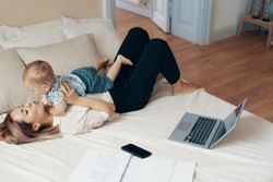 Business mom takes a break. Multi-tasking, freelance and motherhood concept