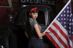 Girl with US Flag on an old truck