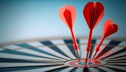 Aim for Success: Achieving Accuracy and Hitting the Bullseye in the Competitive Sport of Darts with Dartboard, Arrows, and Red Targets