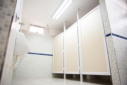 Public restrooms of the school. with modern design, new hand wash, beautiful colored tiles, faucet with mirror and window.