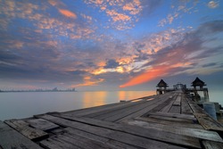 Landscape of Wooded bridge in the port between sunrise.Chonburi Thailand