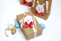 Easter bunny gift bags. Instruction manual. DIY paper crafts together with children. Gift for the Easter.  Сreative idea for Easter party. Children's art project. 
