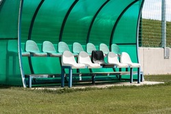 a bench on the green field, football stadium bench for team, Reserve and staff coach bench in sport stadium, copy space, Slovakia, Europe
