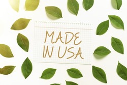 Handwriting text Made In Usa. Business concept American brand United States Manufactured Local product Notebook Sheet With Fresh Leaves For Creative Invitation And Cards.
